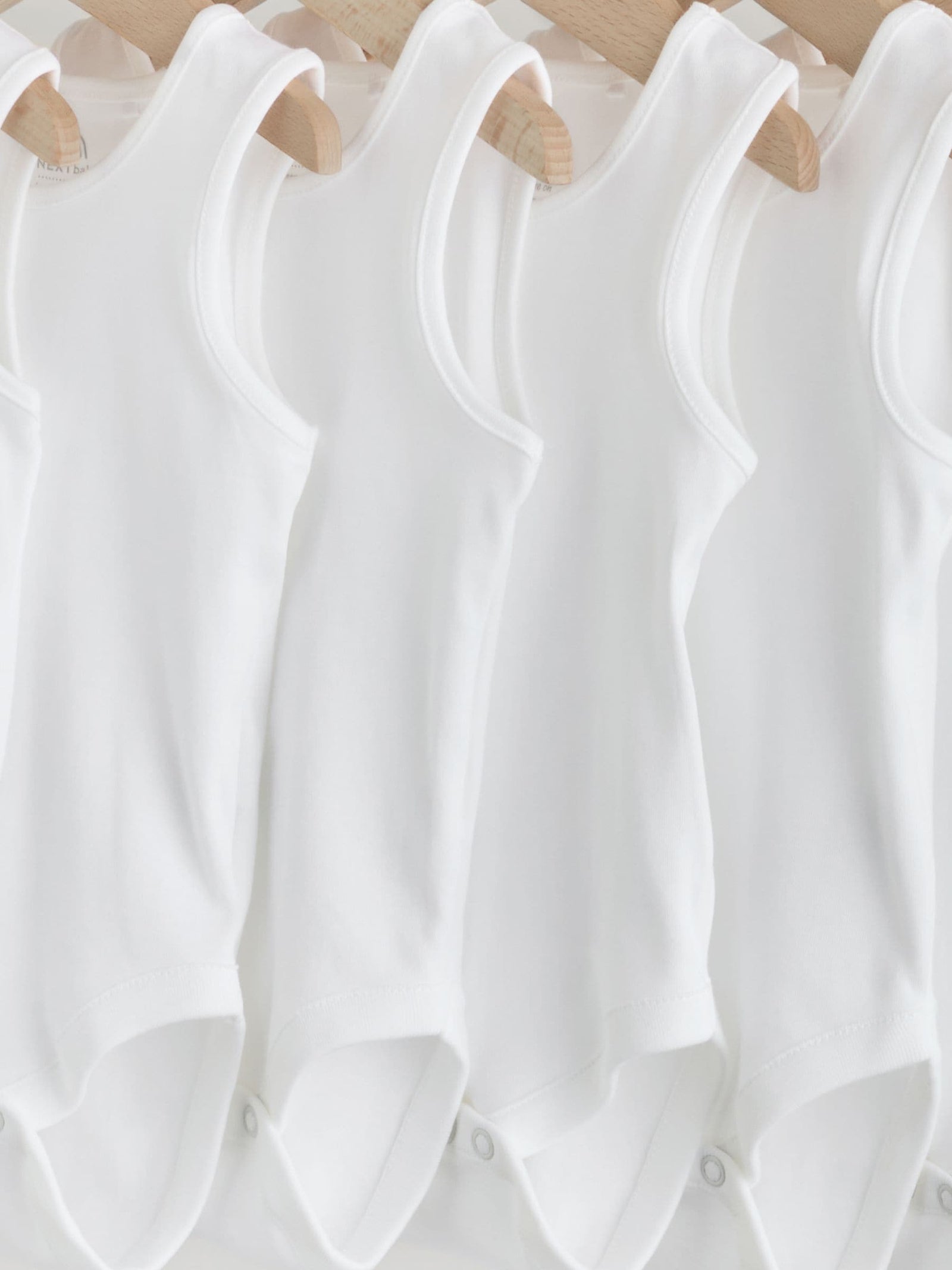 White 7 Pack Baby Vest Bodysuits