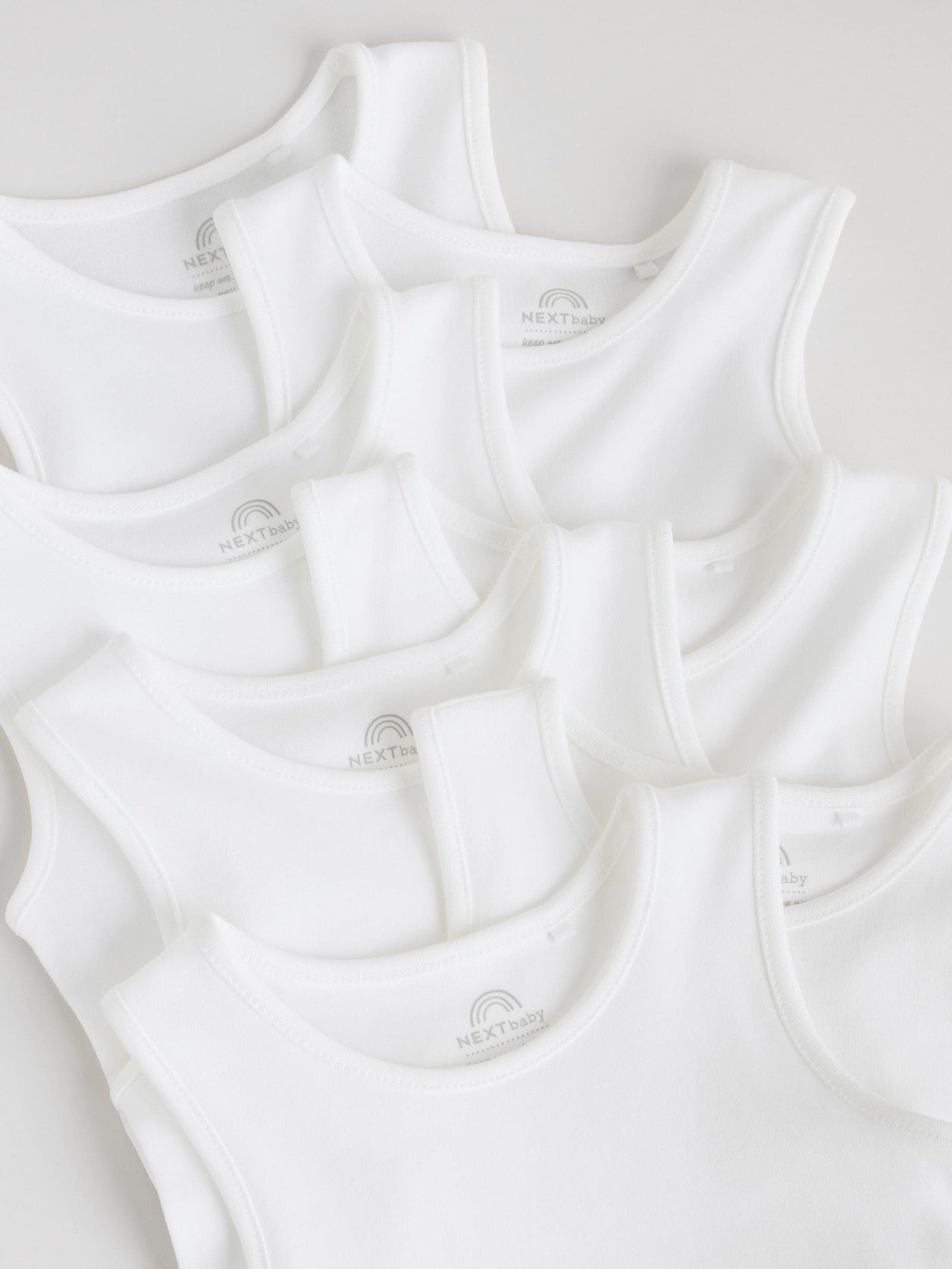 White 7 Pack Baby Vest Bodysuits