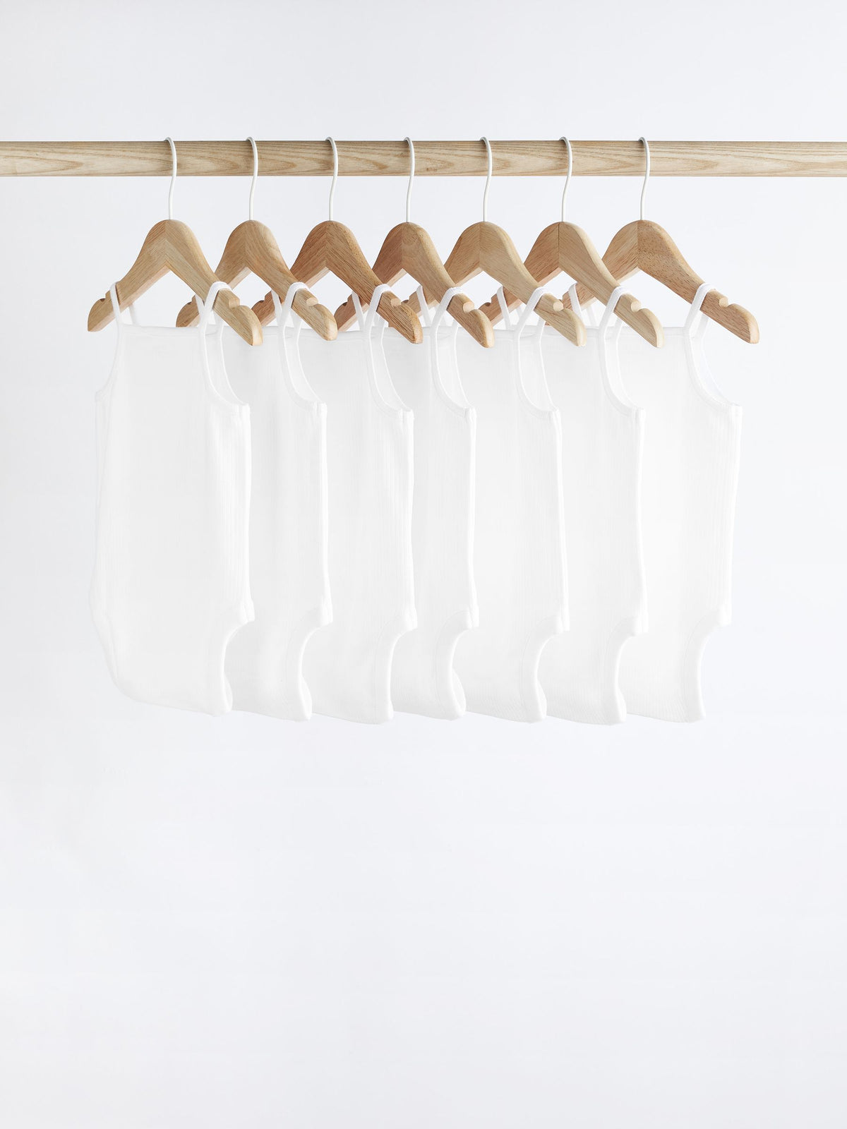 White 7 Pack Baby Strappy Bodysuits