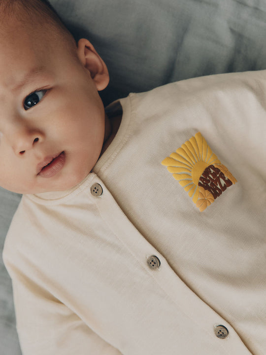 Neutral Sunshine Rebecca Zwanzig Seminal Printed Button Through Baby Romper